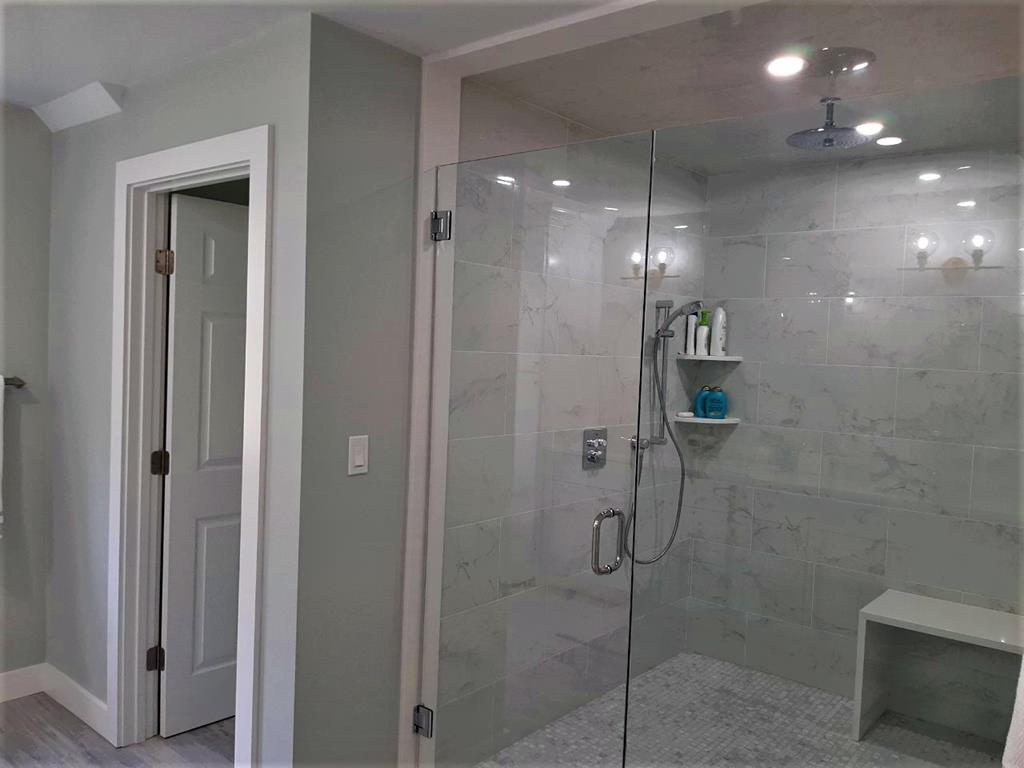 Large glassed in shower in master