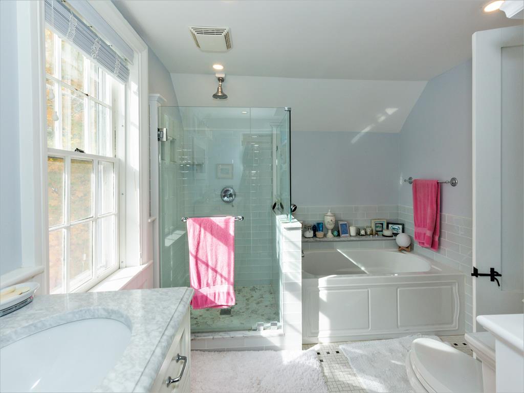 MASTER BATHROOM with soaking tub/glass shower