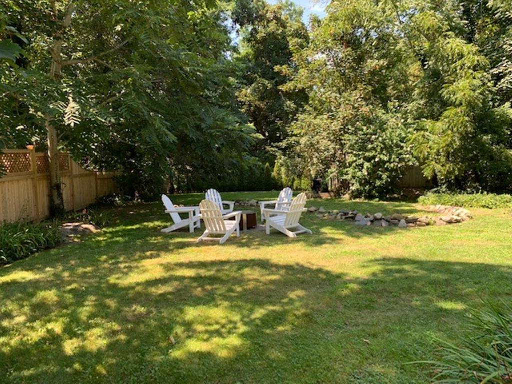 view of backyard and firepit