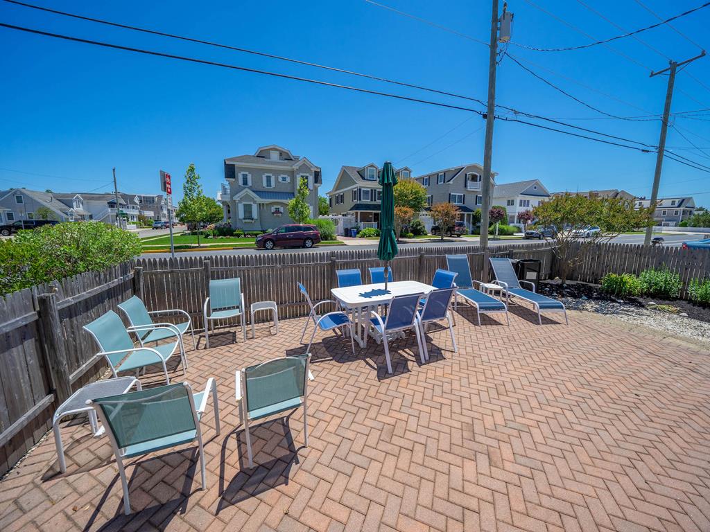 Fenced in patio off kitchen