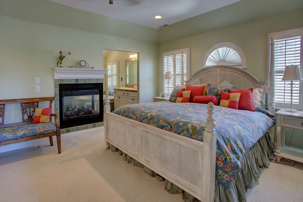 Master king bed with view of fireplace