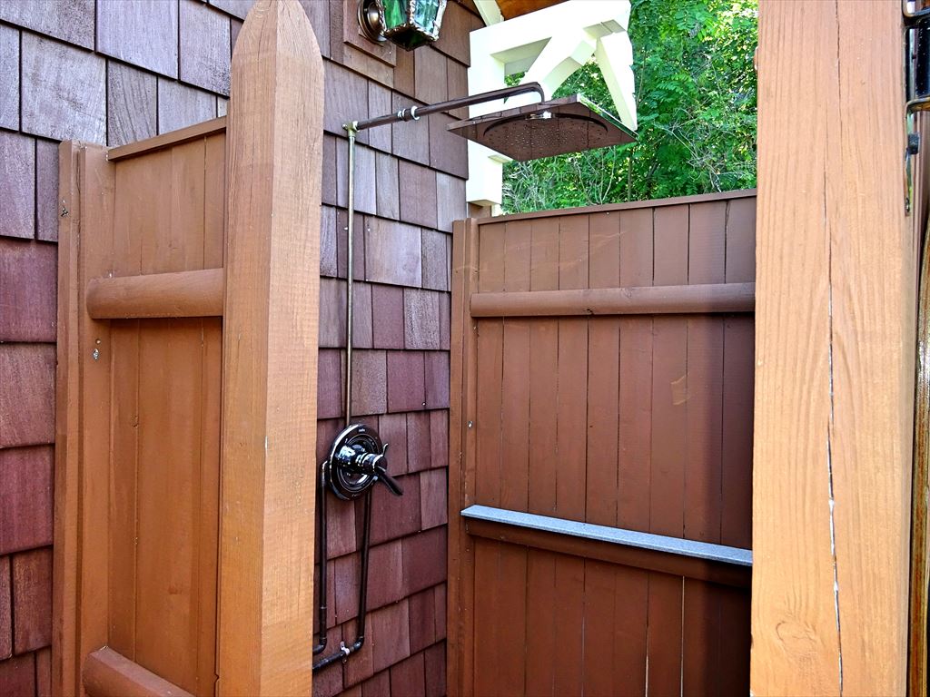 Outdoor shower with rainfall shower head