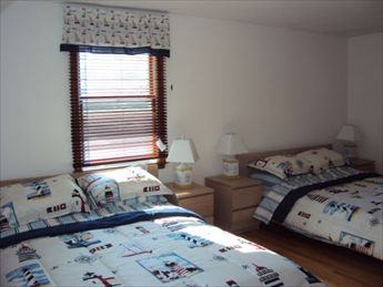 upper level bedroom with two queens and window A/C