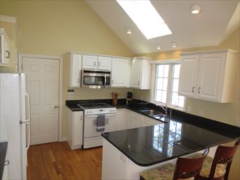 Lovely kitchen open to dining room & sunroom