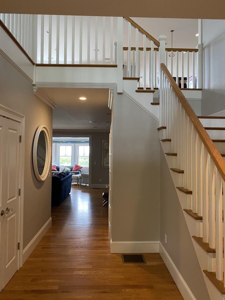 Foyer w staircase to Kitchen Living and Primary Bedrm