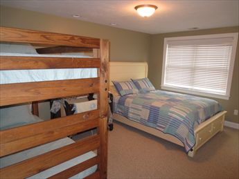 Queen bedroom %353 with set of bunks