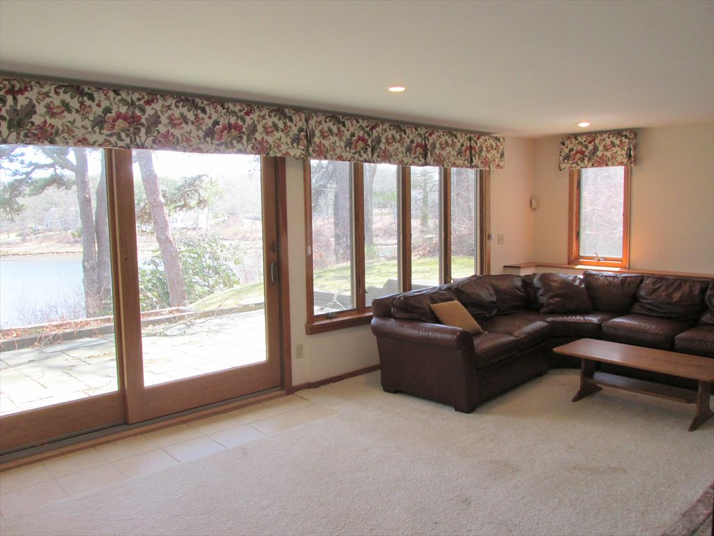 Another family room view showing patio and waterview