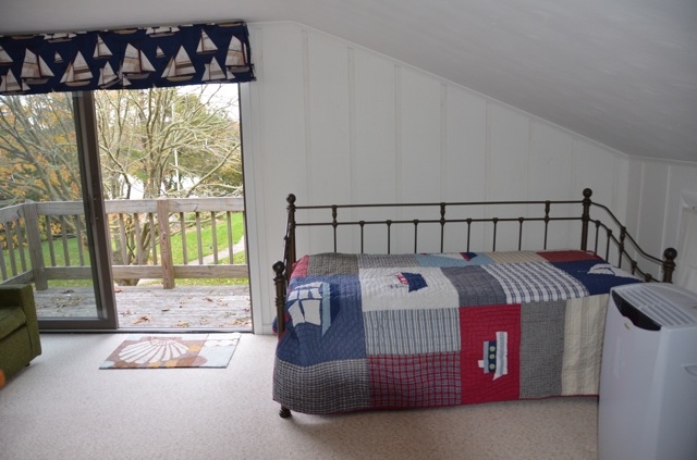 another bunk room view showing day bed/trundle and 2nd floor deck