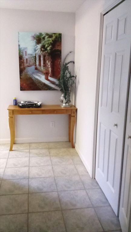 Hallway off of kitchen to garage,laundry, and basement door